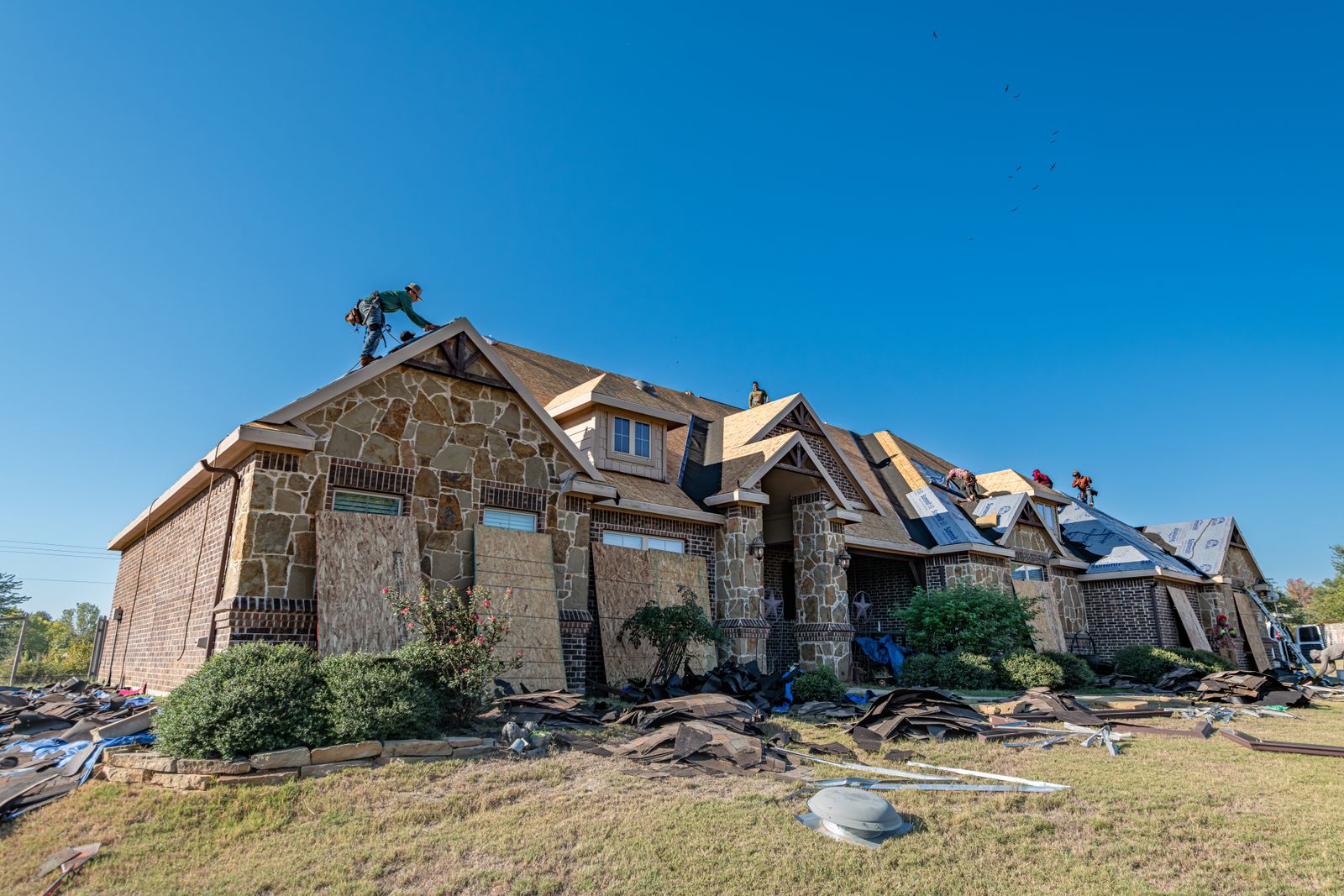 Storm-damaged roof before repair